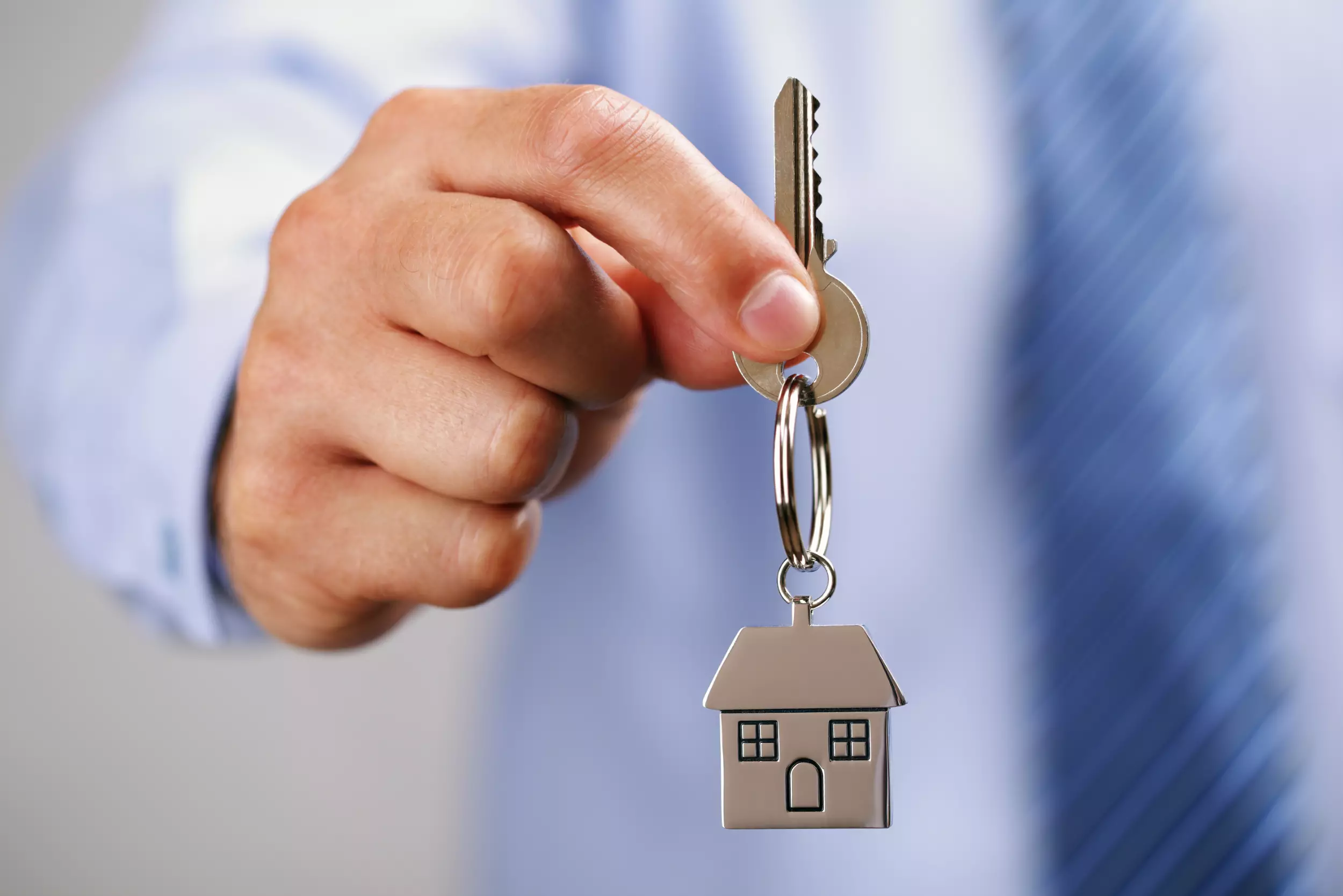 A realtor holding house keys